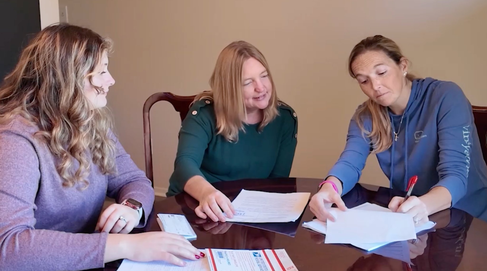 Clean Slate Home Buyer team meeting with a homeowner to review paperwork